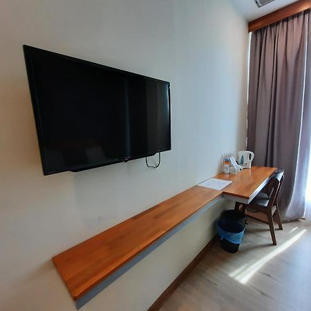 Hotin Inn Кучинг Экстерьер фото
